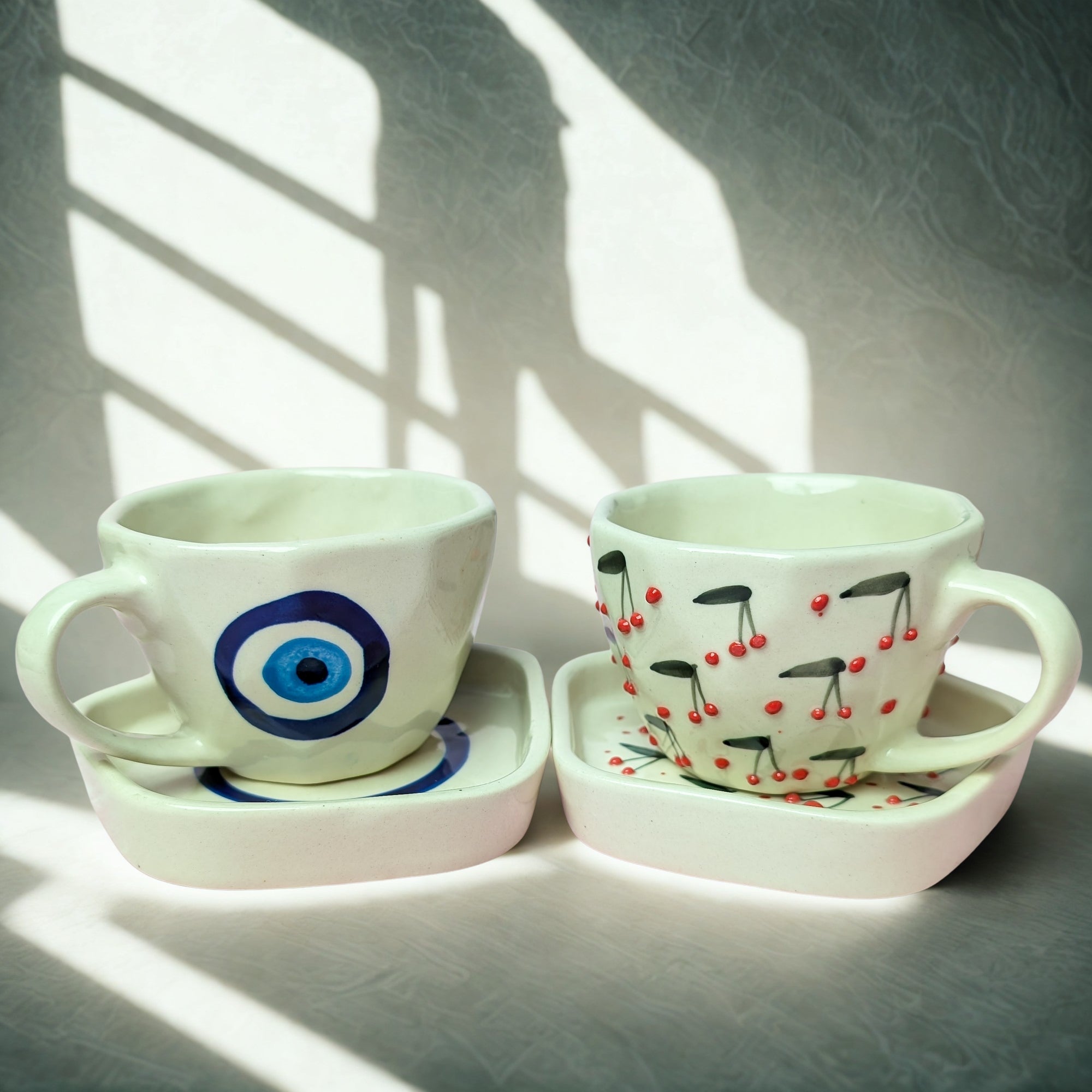 Duo Ceramic Cup & Saucer Set – Handmade Evil Eye & Cherry Blossom Design (300 ml, Set of 2)